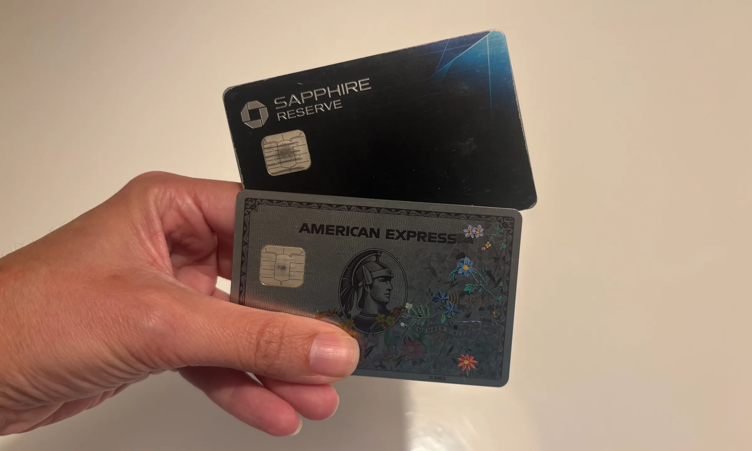 Six credit cards split into two groups representing the Chase Trifecta and Amex Trifecta rewards strategies compared side by side in 2026